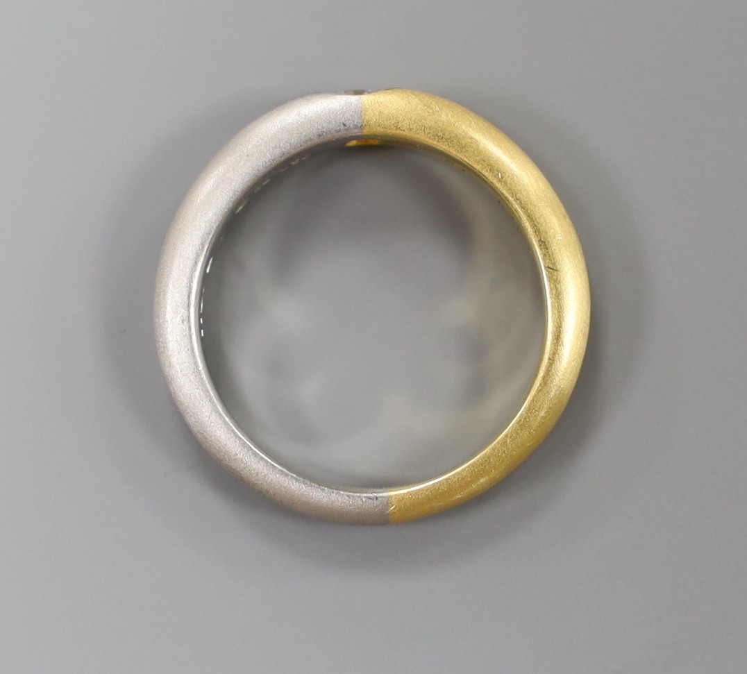 A modern sandblasted plat and 750 yellow metal ring, with gypsy set diamond, size M, gross weight 7.1 grams
